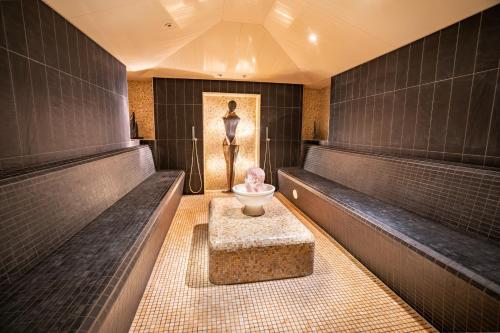 Grandhotel Lienz Business-Wellness & Gourmetにあるベッド