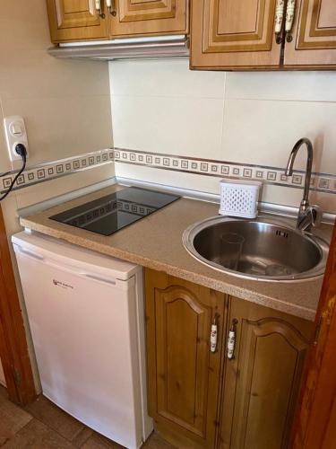 Kuchyň nebo kuchyňský kout v ubytování Rebeca Rooms