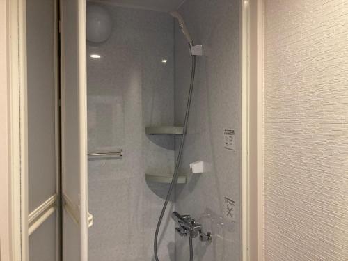 a shower in a bathroom with a glass door at Koya TRIBE - Vacation STAY 83089v in Oishi