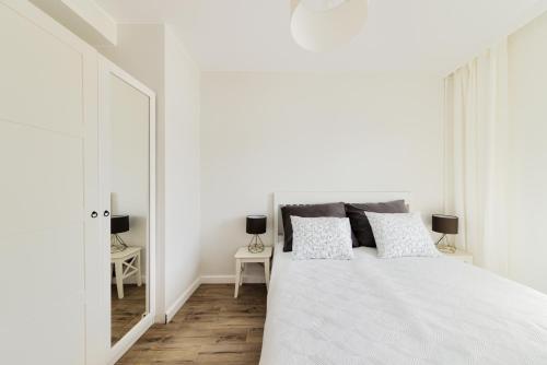 Posteľ alebo postele v izbe v ubytovaní Apartament Nadmotławski Sen