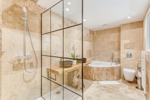 A bathroom at DOMAINE DE LA NERTHE- HOTEL PROVENCE MEDITERRANEE