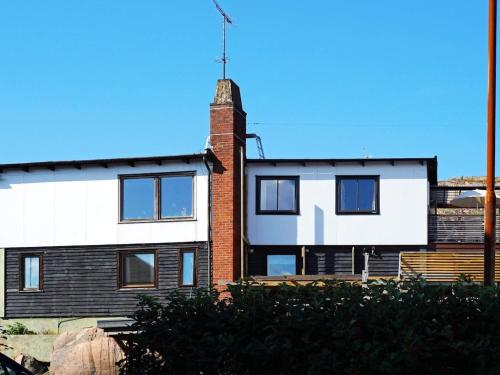 a house with a brick chimney on top of it at 4 person holiday home in LYSEKIL-By Traum in Lysekil
