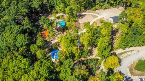 an overhead view of a park with trees and a road at Yourtes Glamping du Poisson Blanc in Notre-Dame-du-Laus