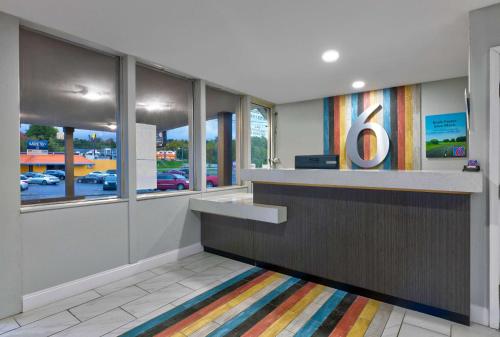 a lobby with a counter with the number four at Motel 6 Corbin KY in Corbin