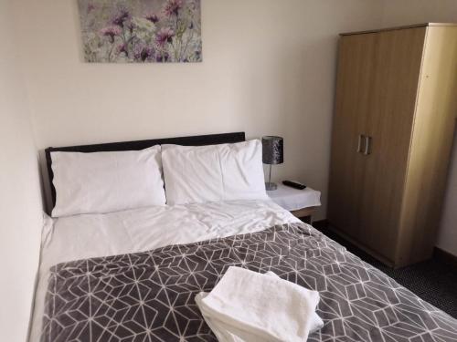Postel nebo postele na pokoji v ubytování Budget Rooms