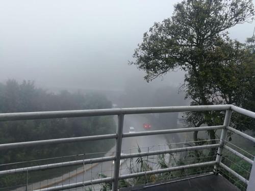 a view from the top of a mountain in the fog at Exelentes departamentos y lofts en el centro de la ciudad de Teziutlán in Teziutlán
