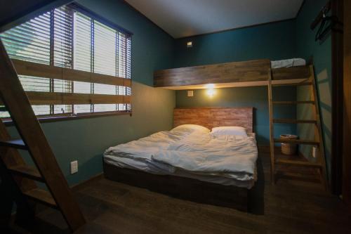 Ένα ή περισσότερα κρεβάτια σε δωμάτιο στο Lodge Hahnenkamm