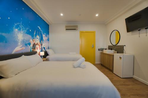 a hotel room with a bed and a tv at Dreamy Stays Accommodation - Private Rooms with Shared Bathrooms in Adelaide