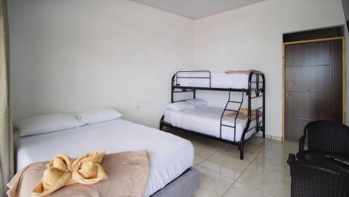 Ein Bett oder Betten in einem Zimmer der Unterkunft Hostel Cattleya - Monteverde, Costa Rica