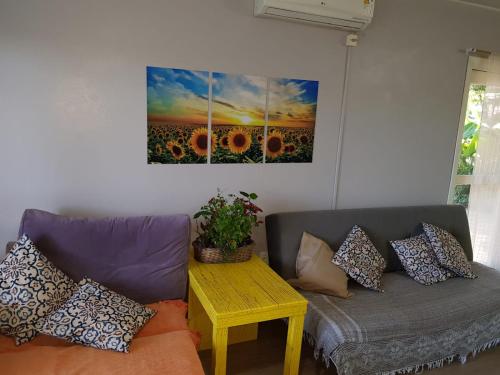 a living room with a couch and a table at Casa Deni in Nova Petrópolis