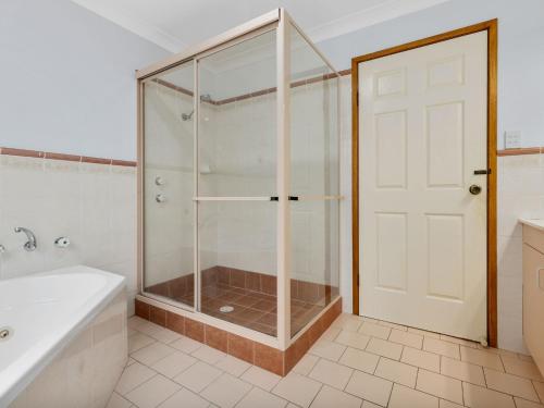 a shower with a glass door in a bathroom at Southern Escape by Experience Jervis Bay in Sanctuary Point