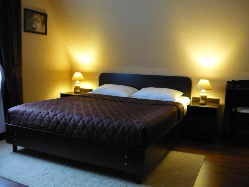 En eller flere senge i et værelse på Комплекс Спасатель