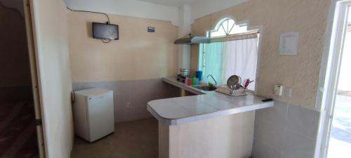 A kitchen or kitchenette at Hotel las cúpulas