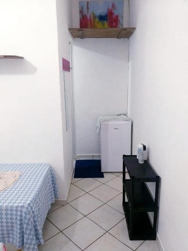 Postel nebo postele na pokoji v ubytování SUITES COR DO SOL TRINDADE