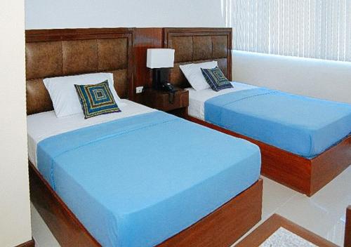 Katil atau katil-katil dalam bilik di Sky Garden Hotel by RedDoorz