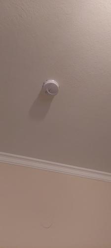 a white ceiling with a light on top of it at Family Apartment in Patra