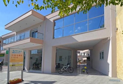 a building with two bikes parked outside of it at Aventura Apartments Potos in Potos