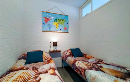 a room with two beds with mermaid pillows at 2 Bedroom Cozy Home In Bruinisse in Bruinisse