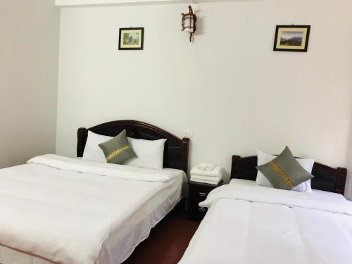 Ένα ή περισσότερα κρεβάτια σε δωμάτιο στο ANH ANH HOTEL