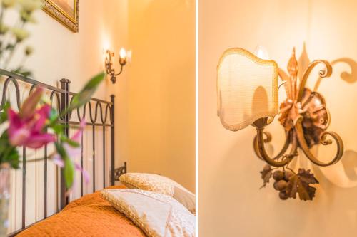 a bedroom with a bed with a mirror and a lamp at Soggiorno Campos in Florence