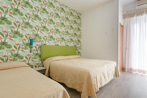 Postel nebo postele na pokoji v ubytování Hotel Clipper