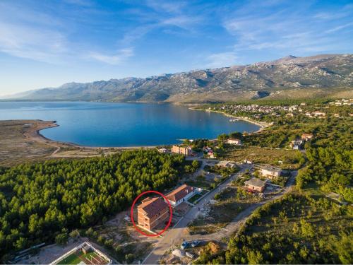 an aerial view of a lake with a red circle at APARTMAN DANE in Rovanjska
