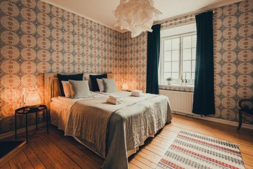 Ένα ή περισσότερα κρεβάτια σε δωμάτιο στο Gysinge Wärdshus Hotell