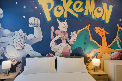 a bedroom with a mural of pokemon on the wall at Dreamy Stays Accommodation - Private Rooms with Shared Bathrooms in Adelaide