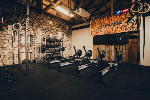 a gym with rows of exercise bikes in a brick wall at STF Gysinge Wärdshus & Hotell in Gysinge