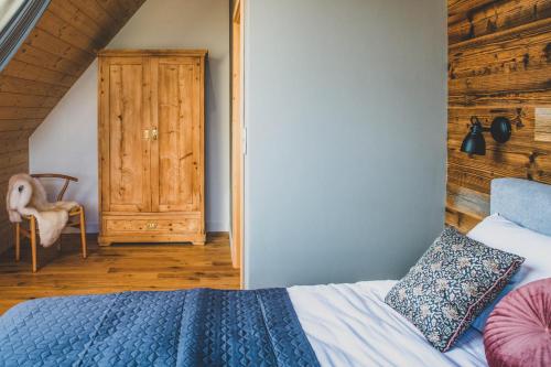 Cama o camas de una habitación en Czarne Wierchy Domy Premium