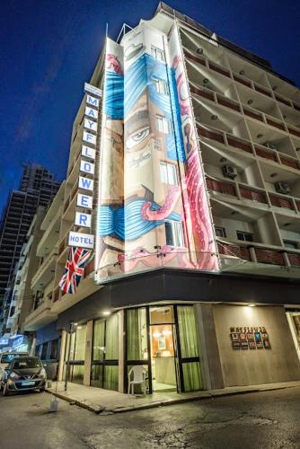 a building with a large sign on the side of it at The Mayflower Hotel in Beirut