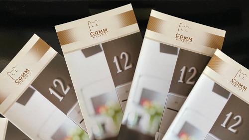 a row of wine boxes with the words kennwell on them at Comm Hotel Poznań Airport in Poznań