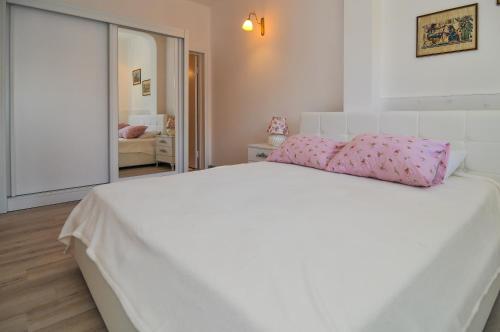 Postel nebo postele na pokoji v ubytování Apartments Villa Stankovic