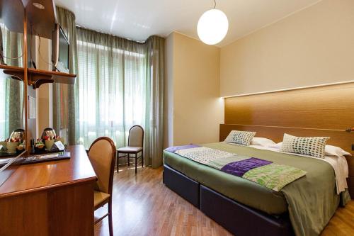 Ένα ή περισσότερα κρεβάτια σε δωμάτιο στο Park Hotel Meublé