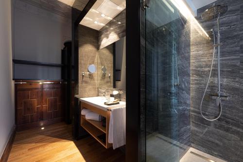 a bathroom with a shower and a sink at Boutique Hotel Cordial Malteses in Las Palmas de Gran Canaria