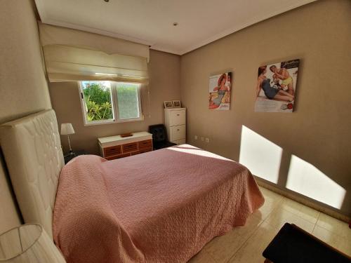 a bedroom with a bed and a window at casa luxury nudista in Vera