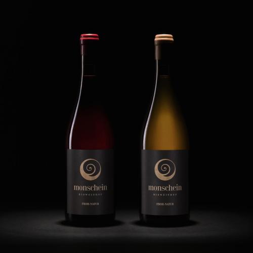 two bottles of wine sitting next to each other at Monschein Weingut Straden in Straden