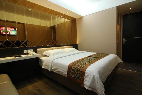 Favor Hotel Makassar City Center By LIFEにあるベッド