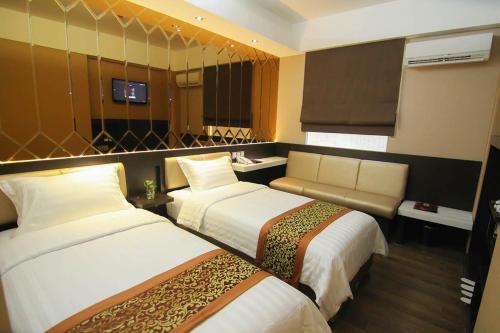 Favor Hotel Makassar City Center By LIFEにあるベッド