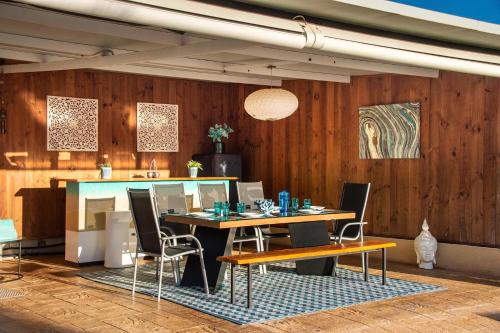 a dining room with a table and chairs at Serena Villa in Ibiza Town