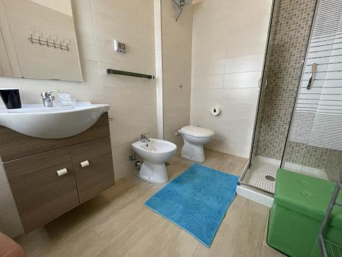 a bathroom with a sink and a toilet and a shower at CconfortHotels R&B Dolci Notti - SELF CHECK IN in Bari