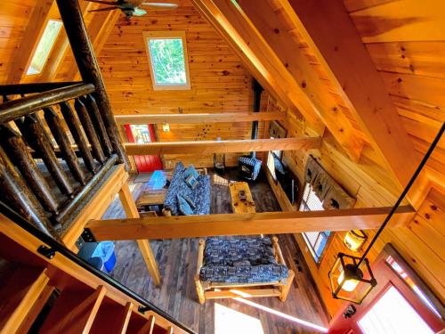 an overhead view of a room in a tree house at BC Log cabin with private beach river fire pit AC wifi onsite trails ski slope views in Carroll