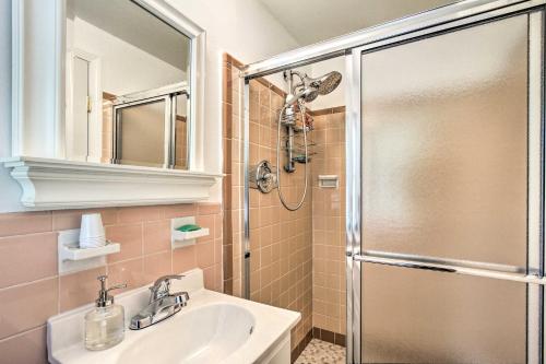 a bathroom with a shower and a sink and a mirror at 20 Mi to Philly Inviting Home with Yard in Wayne! in Wayne