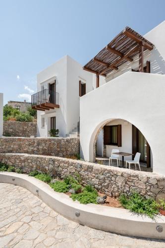 a view of a house with a stone wall at The Authentic Village Boutique Hotel in Khóra Sfakíon