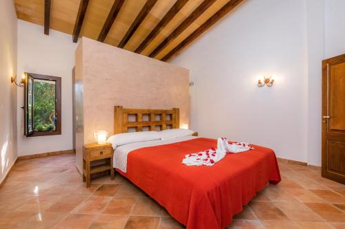 Un pat sau paturi într-o cameră la Villa Toni i María