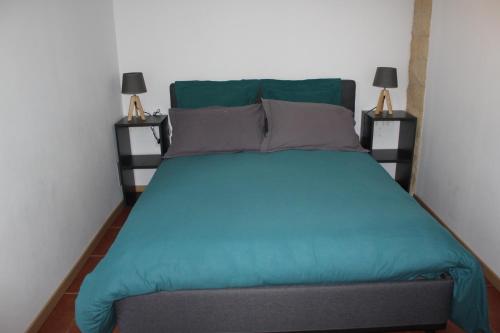מיטה או מיטות בחדר ב-Mas des Oliviers