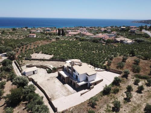 an aerial view of a house with the ocean at ASSINI View in Asíni