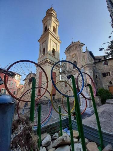 a large building with a clock tower in the background at Casa Vita in Vallebona