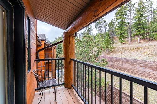 a screened porch with a chair and a window at Comfort Suites Golden West on Evergreen Parkway in Evergreen
