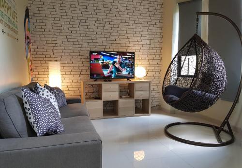 Una televisión o centro de entretenimiento en Danka@tudor residence